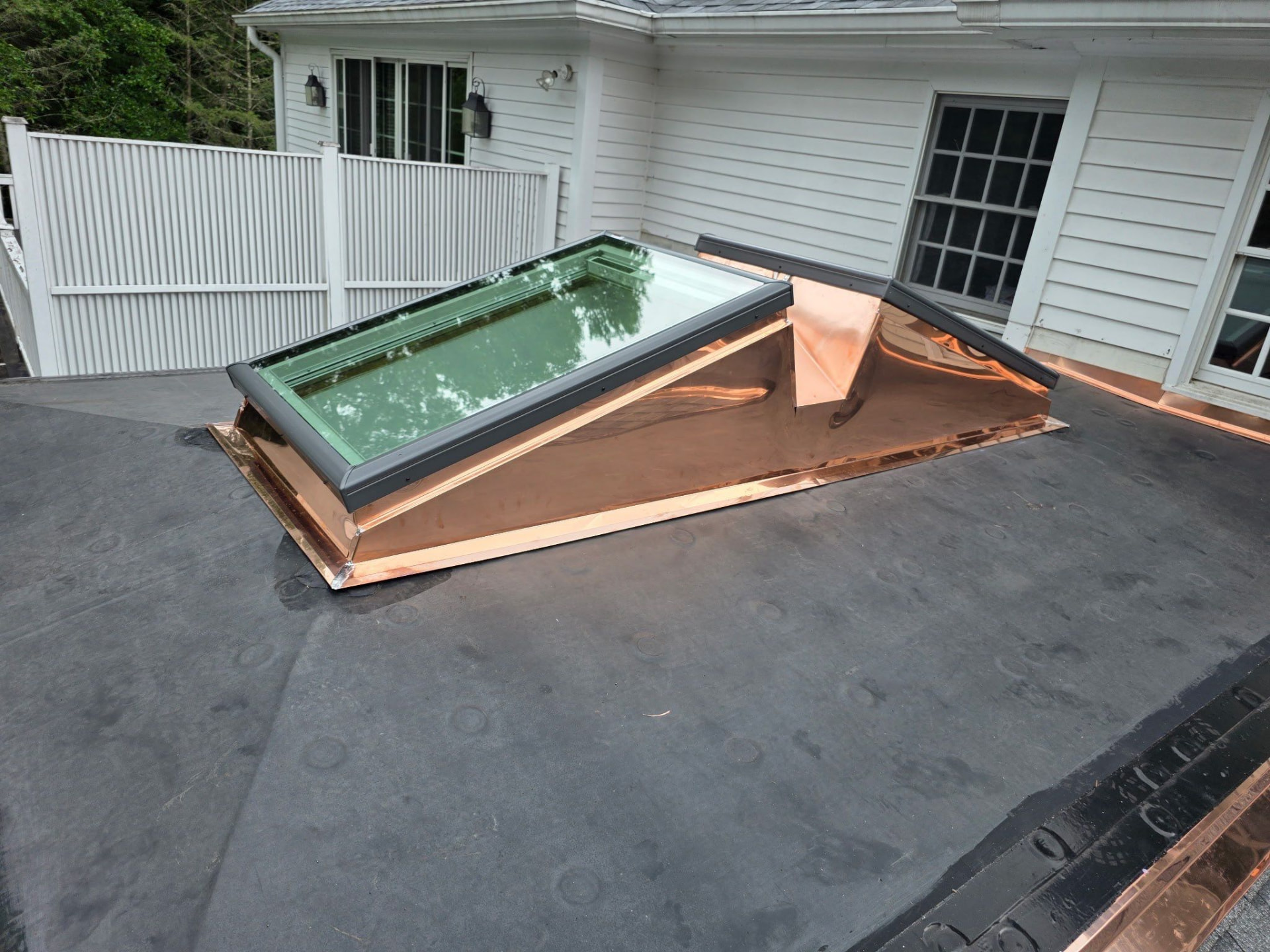 A custom copper accent assembly built around a skylight