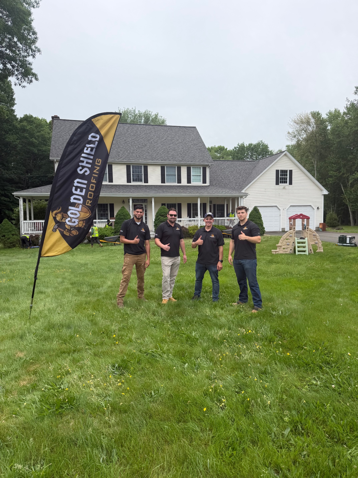 The Golden Shield Roofing team